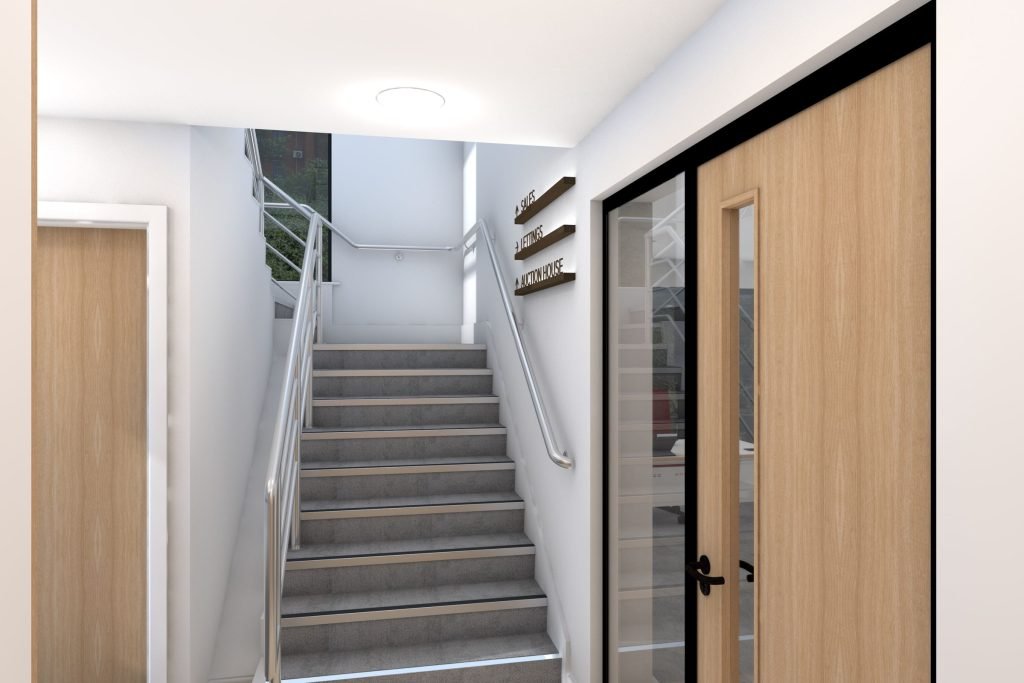 Office staircase with directional signage.